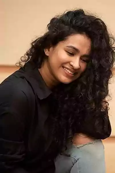 Misha Ghoshal in black shirt