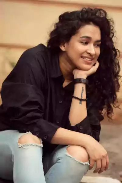 Misha Ghoshal in black shirt