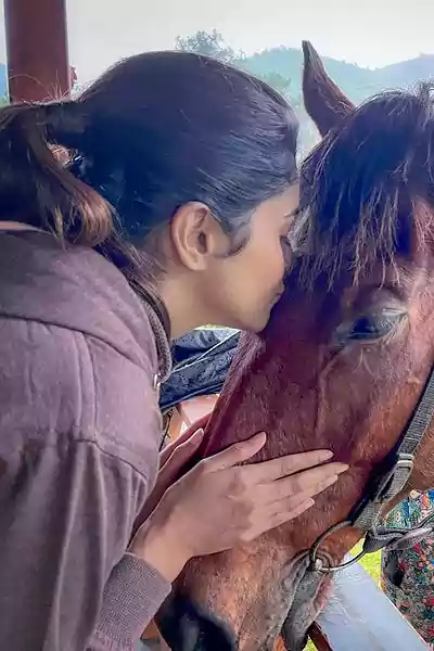 TANYA RAVICHANDRAN kissing a horse